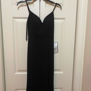 Black,back details,slit,never worn,still has tag